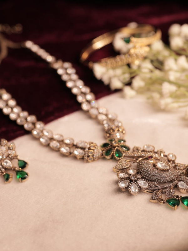 royal peacock design diamond look necklace set with emerald stones