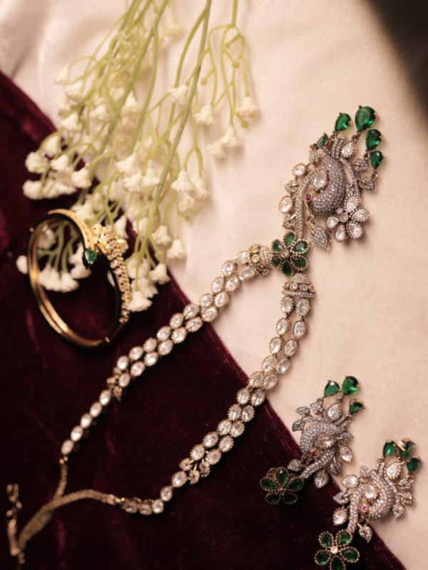 royal peacock design diamond look necklace set with emerald stones